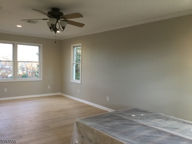 592 Dell Road Landing, NJ 07850 - Photo 27 of 39 an empty room with a window and a ceiling fan