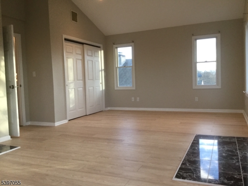 592 Dell Road Landing, NJ 07850 - Photo 30 of 39 an empty room with wooden floor and windows