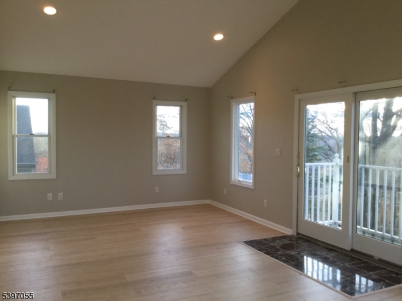 592 Dell Road Landing, NJ 07850 - Photo 32 of 39 an empty room with wooden floor and windows