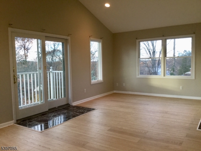 592 Dell Road Landing, NJ 07850 - Photo 33 of 39 a view of an empty room with a window and wooden floor