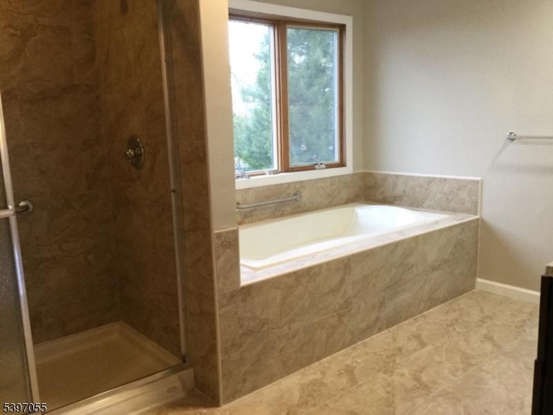 592 Dell Road Landing, NJ 07850 - Photo 34 of 39 a bath tub sitting next to a shower