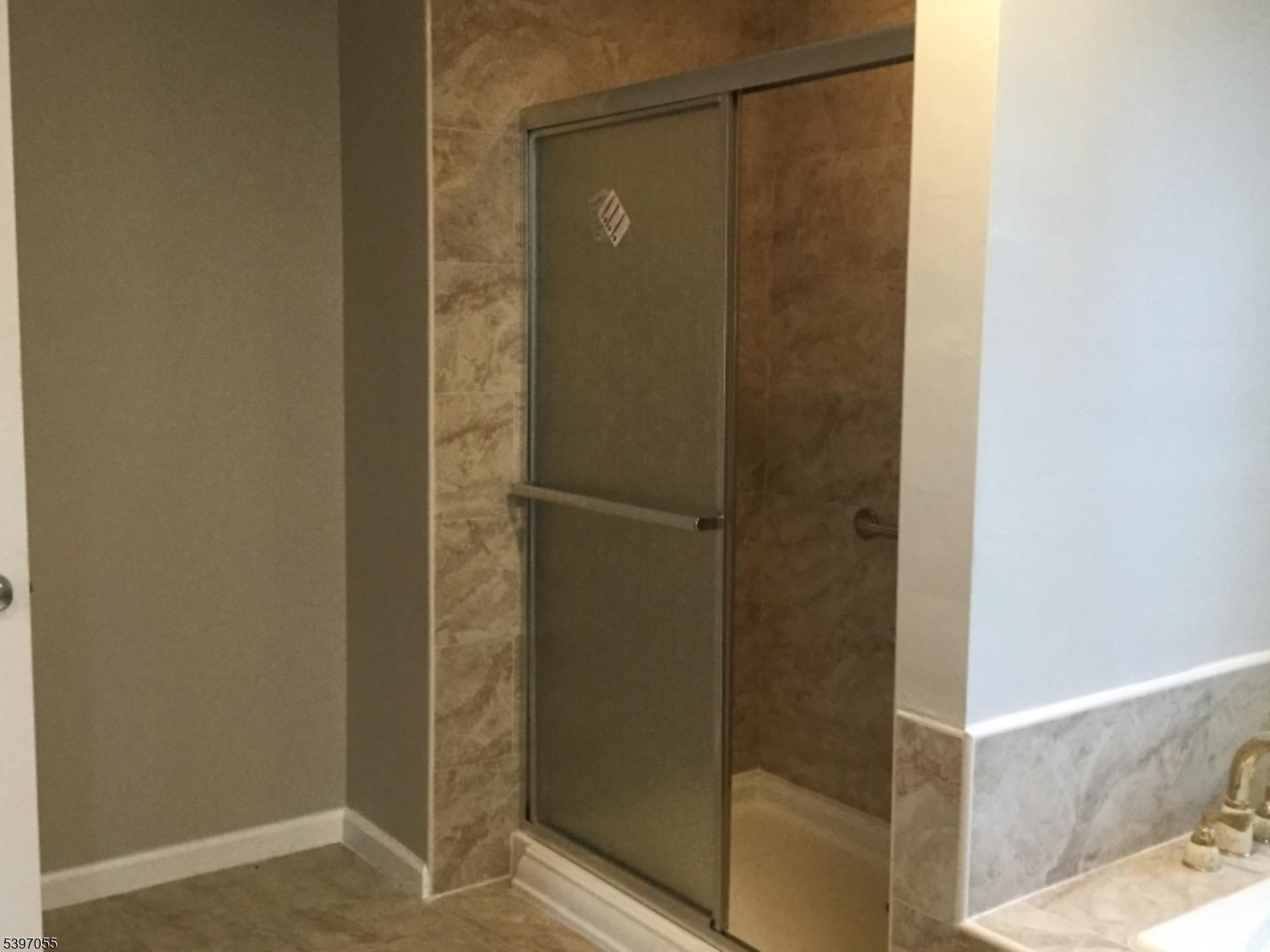 592 Dell Road Landing, NJ 07850 - Photo 35 of 39 a bathroom with a glass shower door