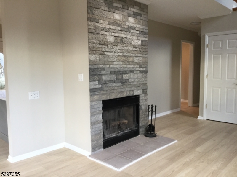 592 Dell Road Landing, NJ 07850 - Photo 6 of 39 a living room with a fireplace
