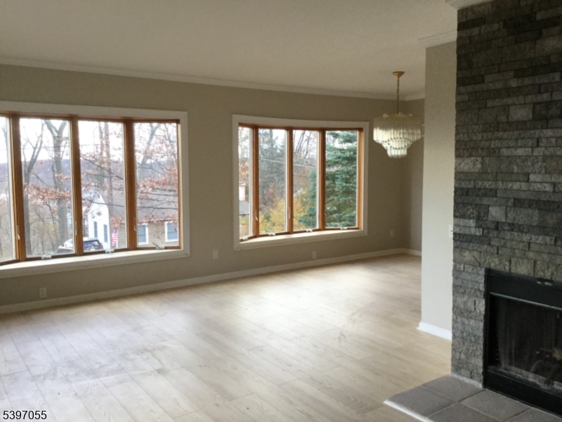 592 Dell Road Landing, NJ 07850 - Photo 9 of 39 a view of an empty room with a fireplace and a window