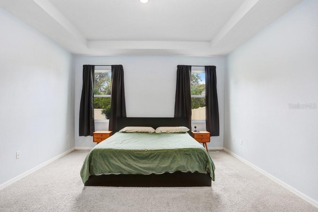 16619 Goose Ribbon Place Wimauma, FL 33598 - Photo 14 of 38 a bedroom with a bed and window