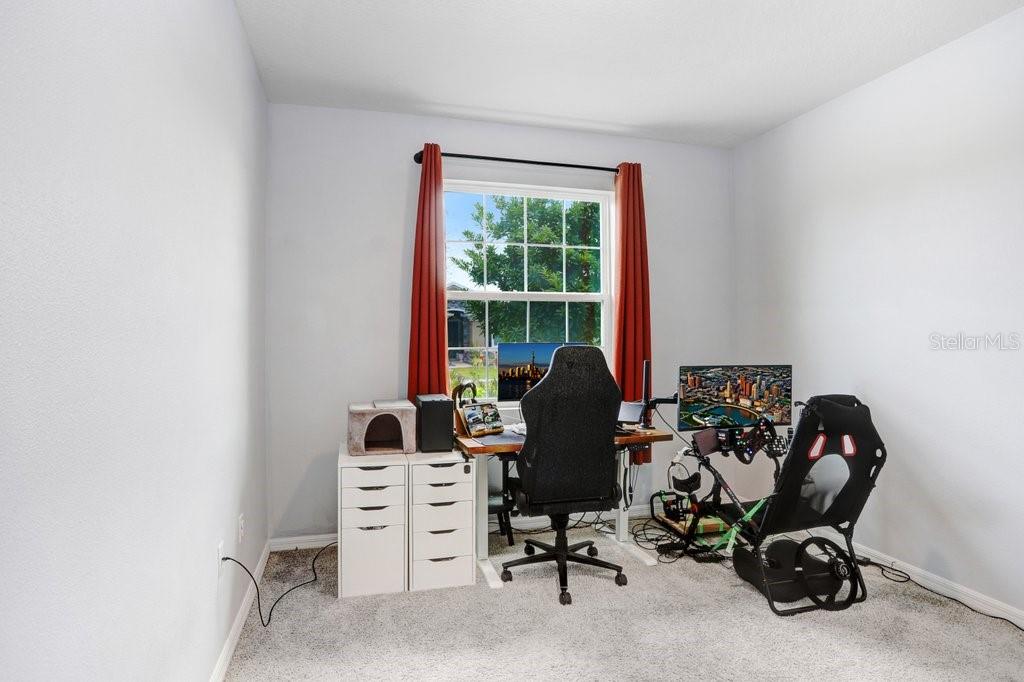 16619 Goose Ribbon Place Wimauma, FL 33598 - Photo 21 of 38 a view of a workspace with furniture and a window