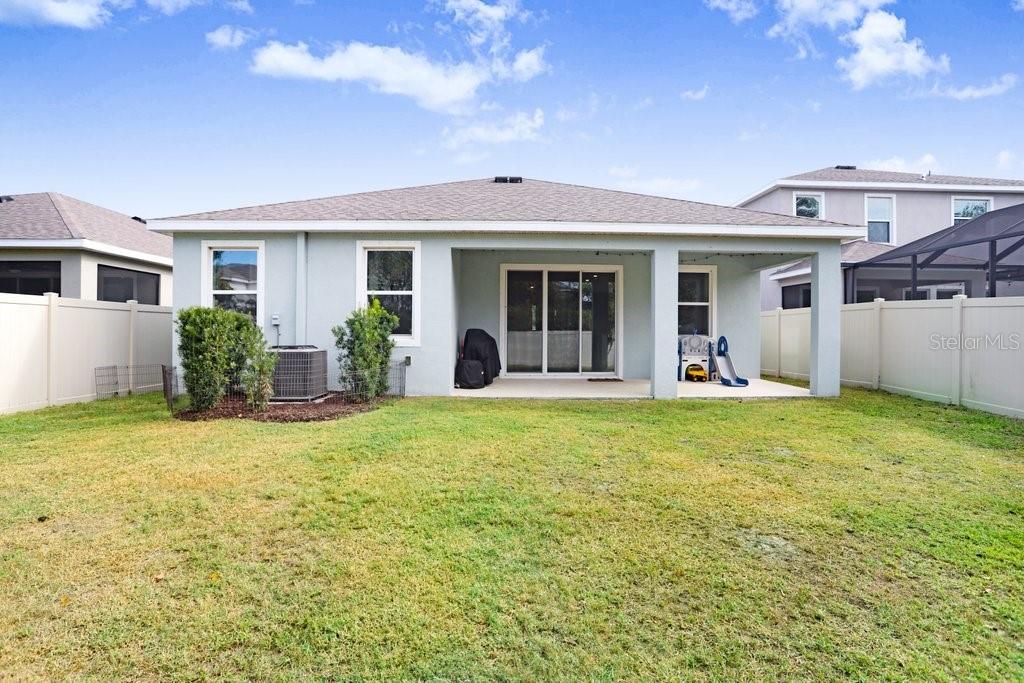 16619 Goose Ribbon Place Wimauma, FL 33598 - Photo 26 of 38 a view of a house with backyard and porch