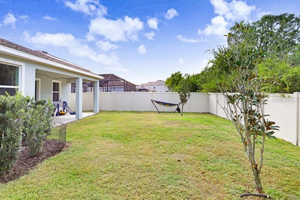 16619 Goose Ribbon Place Wimauma, FL 33598 - Photo 29 of 38 a house view with a garden space