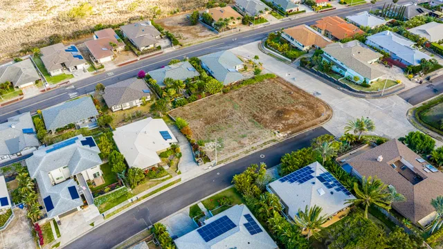 an aerial view of a house with a swimming pool