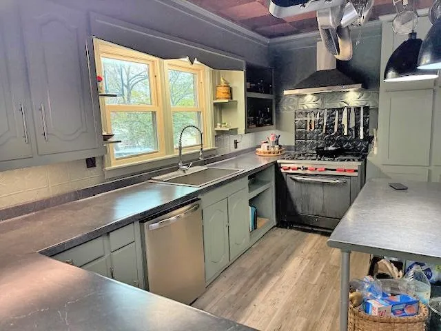 a kitchen with a sink stove and cabinets