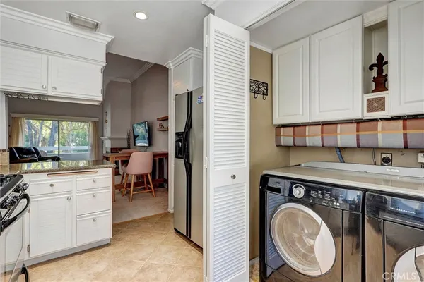 a view of a kitchen with sink and washing machine