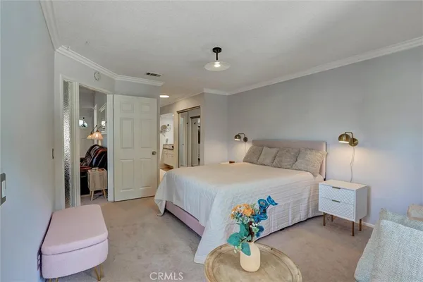 a bed room with a bed and a couch