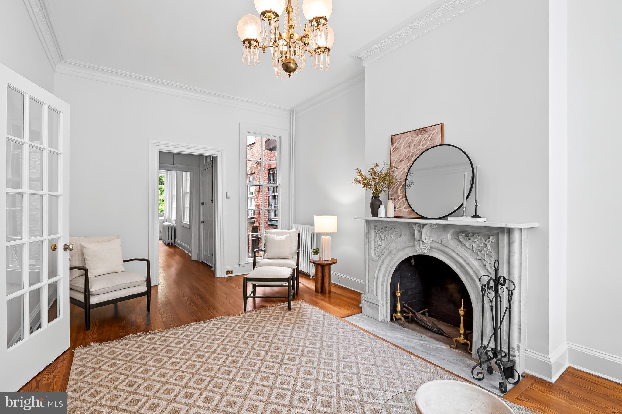 1431 Park Avenue Baltimore, MD 21217 - Photo 12 of 55 a living room with furniture a rug and a fireplace
