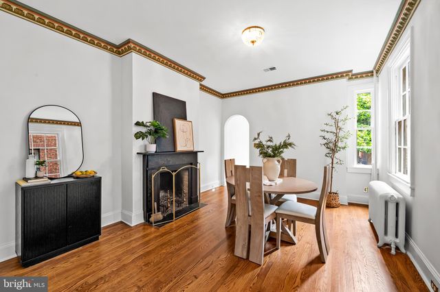 a view of a livingroom with furniture window and wooden floor