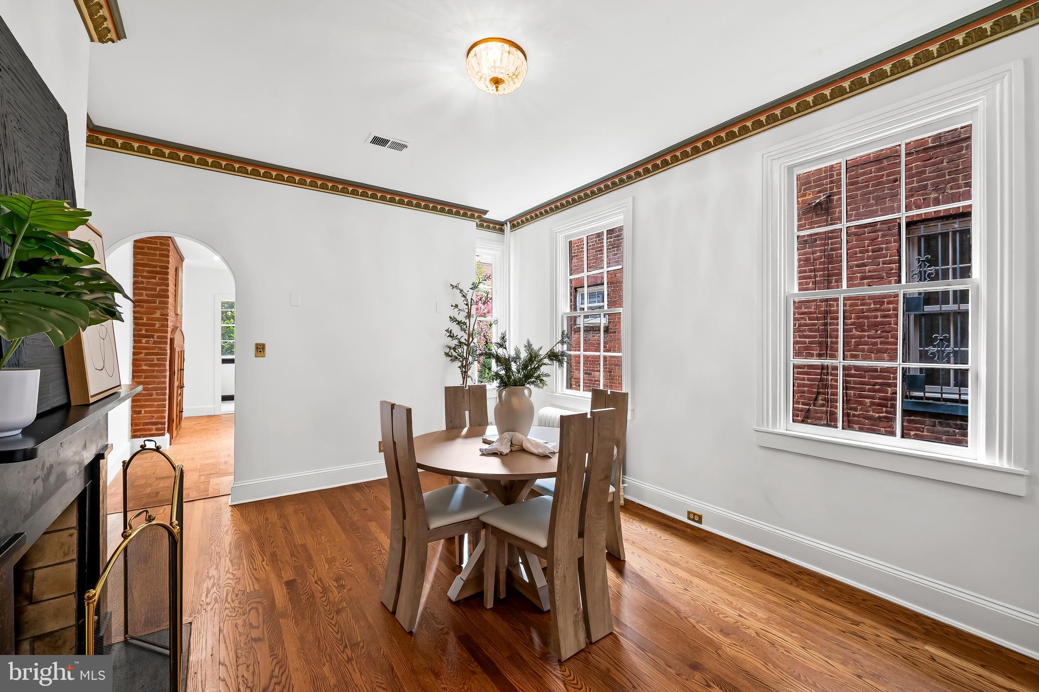1431 Park Avenue Baltimore, MD 21217 - Photo 17 of 55 a view of a dining room with furniture and wooden floor