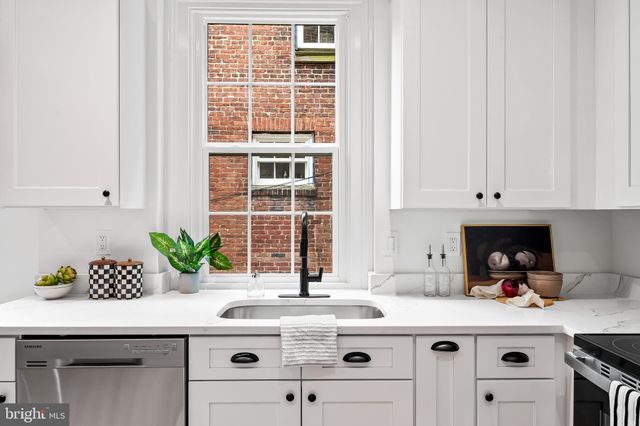 a kitchen with a sink and cabinets