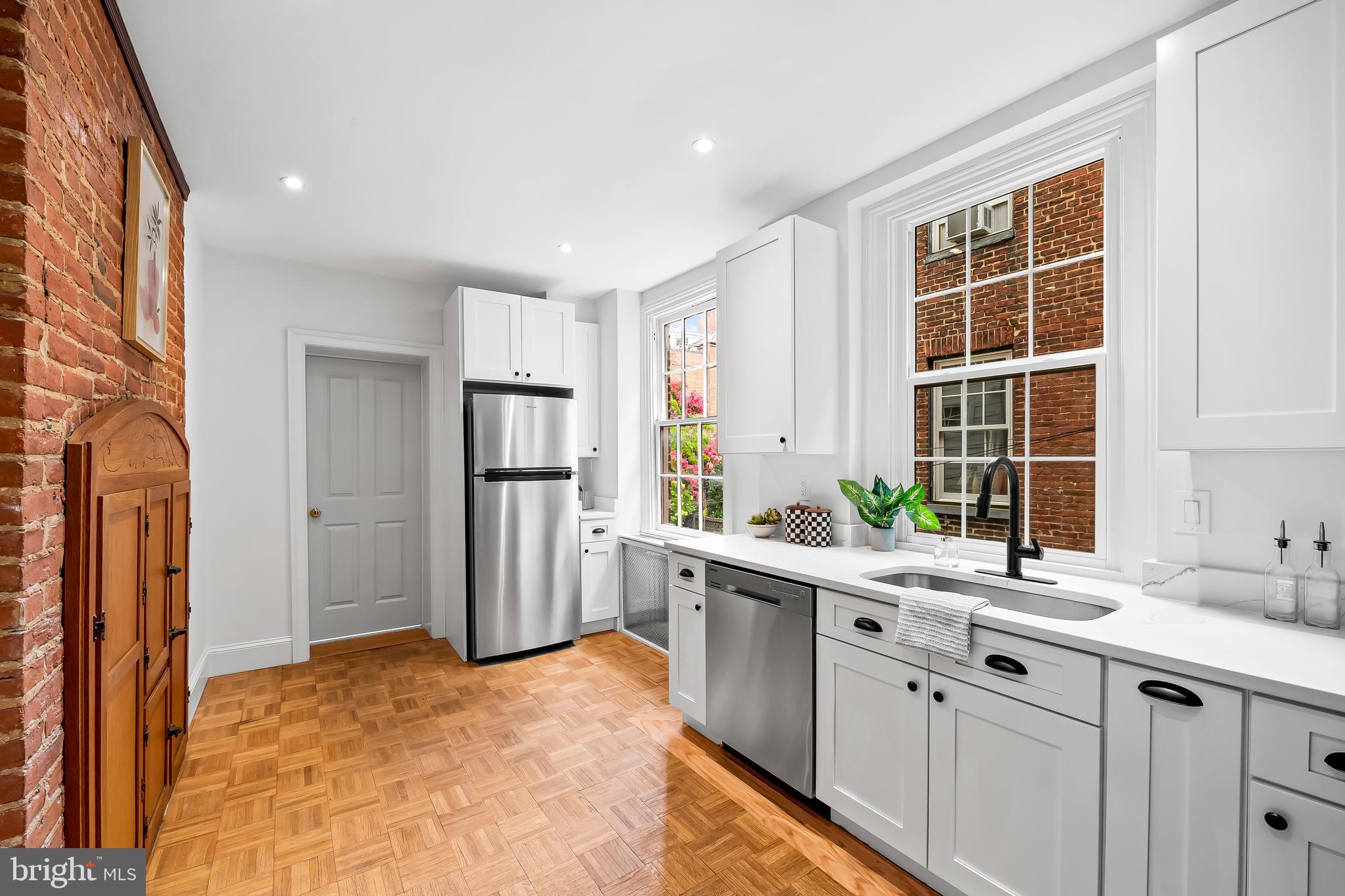 1431 Park Avenue Baltimore, MD 21217 - Photo 22 of 55 a kitchen with stainless steel appliances a refrigerator sink and cabinets