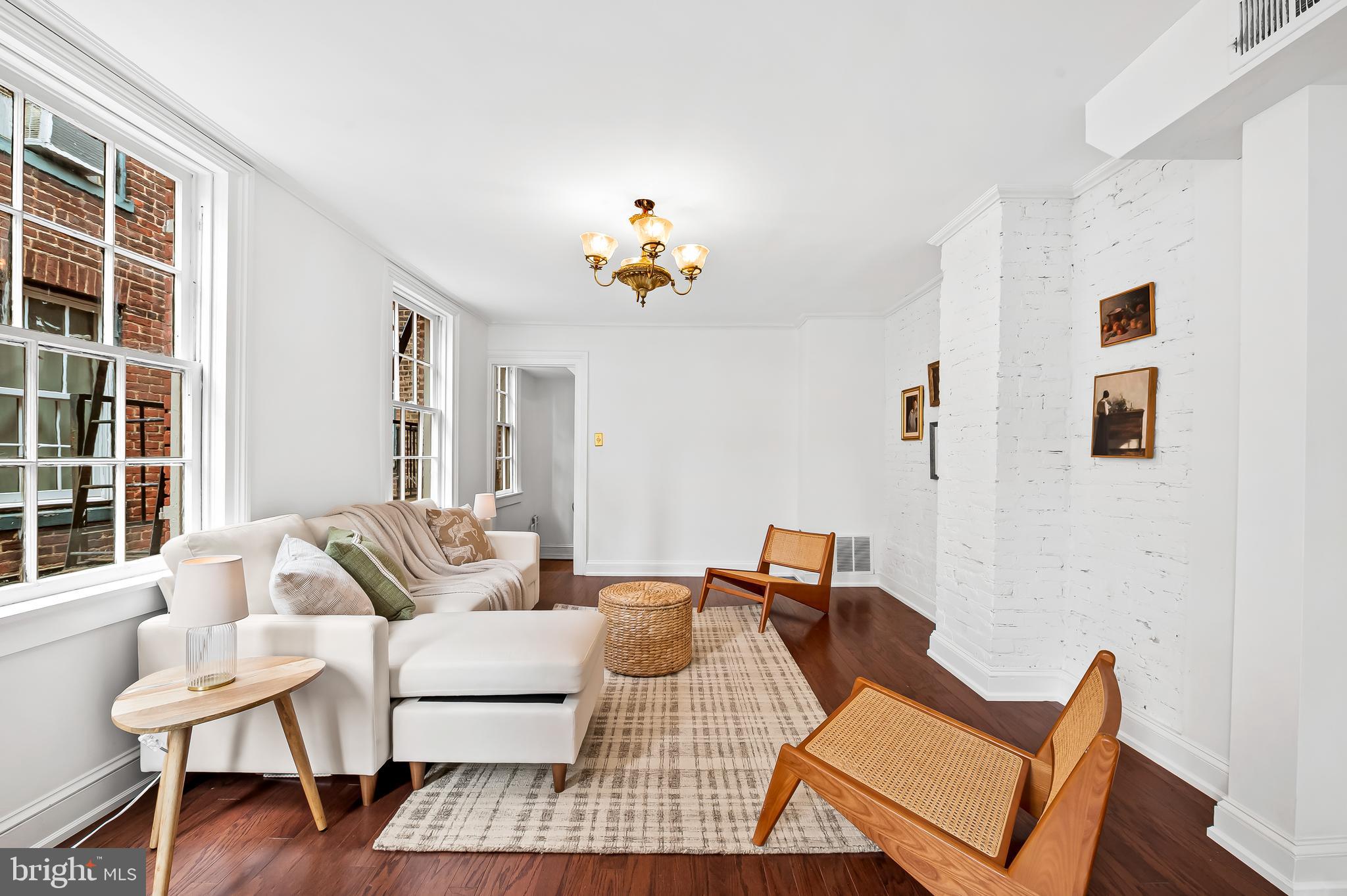 1431 Park Avenue Baltimore, MD 21217 - Photo 26 of 55 a living room with furniture a rug and a window