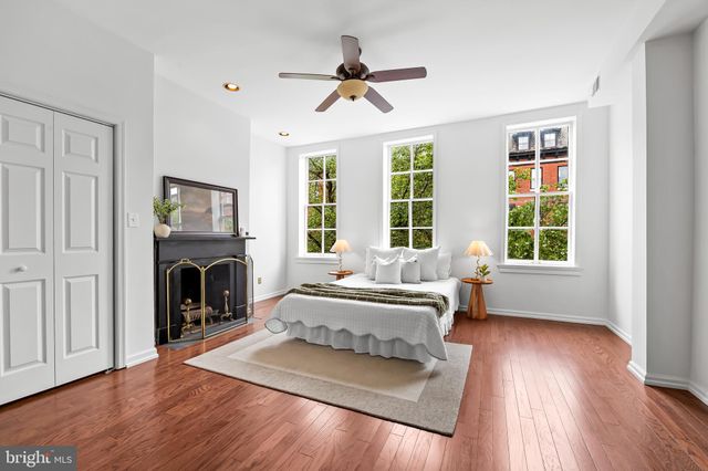 a bedroom with a bed and a tv on table