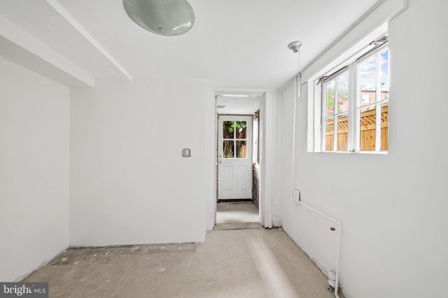 a bathroom with a sink and a window