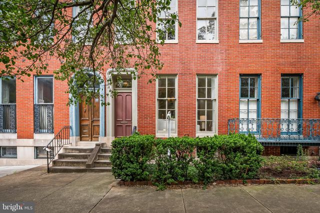a front view of a building with garden
