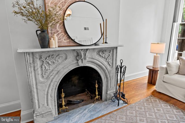 a view of a livingroom with furniture and a fireplace
