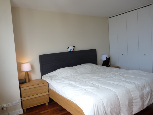655 West Irving Park Road, Unit 4317 Chicago, IL 60613 - Photo 14 of 25 a bedroom with a bed and a night stand