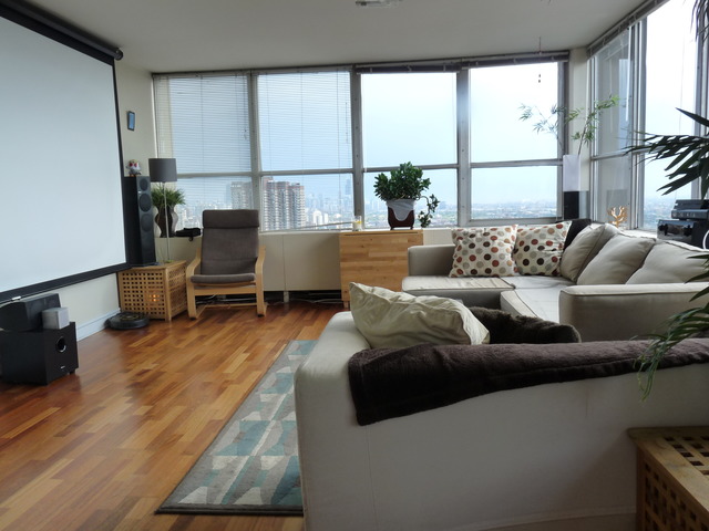 655 West Irving Park Road, Unit 4317 Chicago, IL 60613 - Photo 2 of 25 a living room with furniture and a window