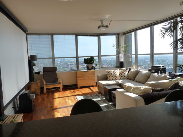 655 West Irving Park Road, Unit 4317 Chicago, IL 60613 - Photo 7 of 25 a living room with furniture and large windows