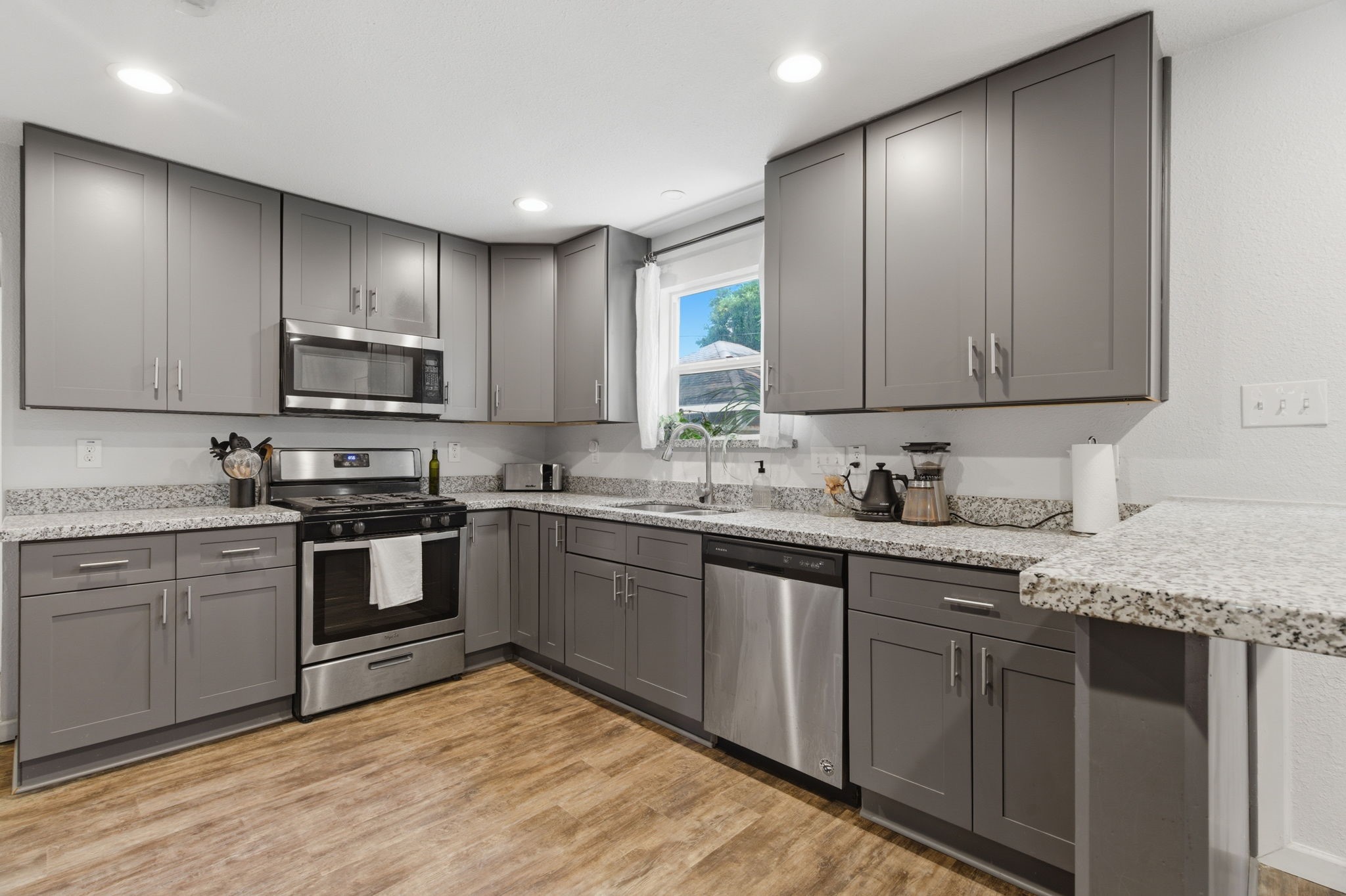 7717 Scanlock Street Houston, TX 77012 - Photo 1 of 46 Beautifully updated and remodeled kitchen, stainless steel appliances and granite countertops