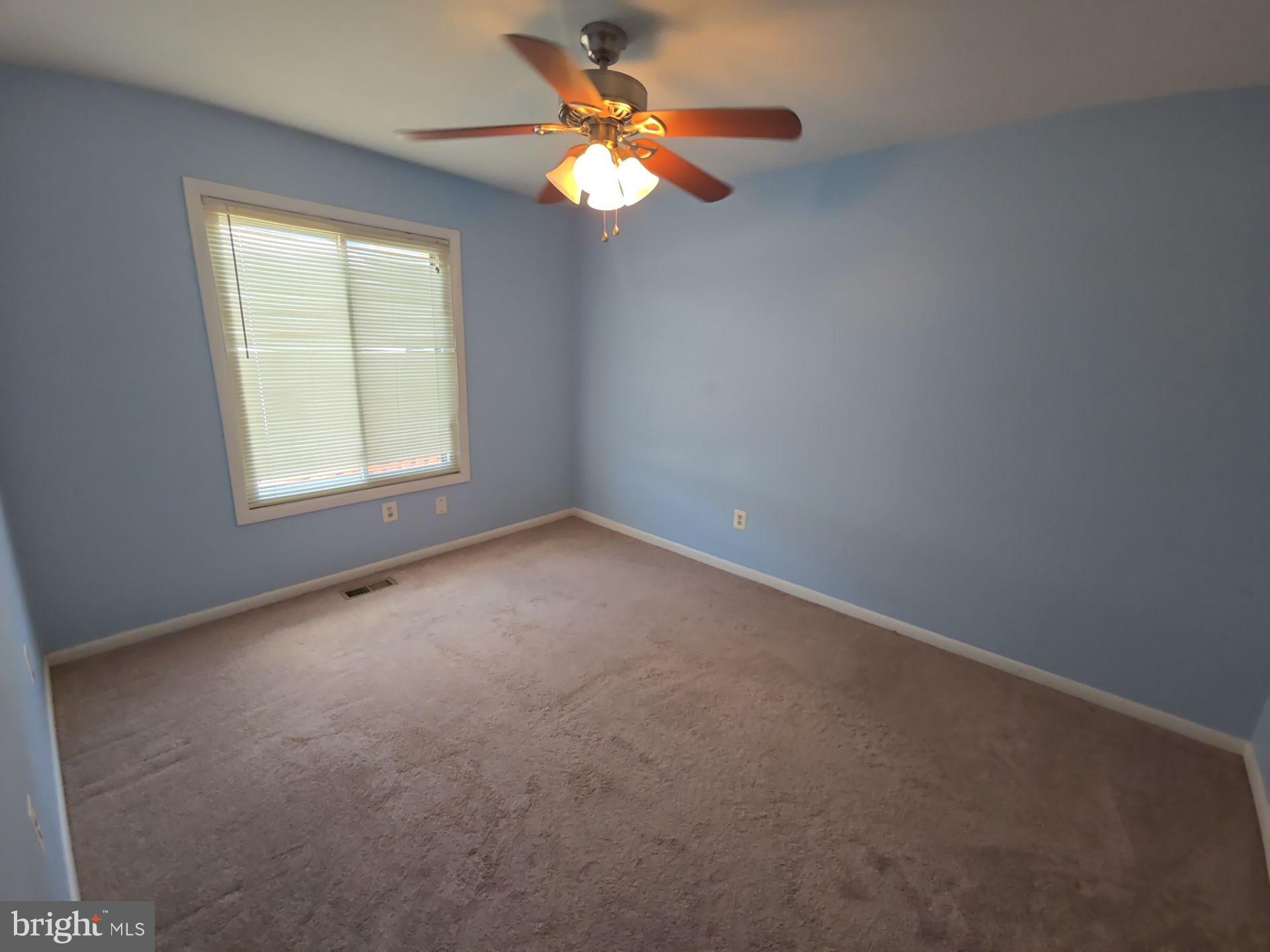 2115 Mager Drive Herndon, VA 20170 - Photo 14 of 41 an empty room with a window and a fan