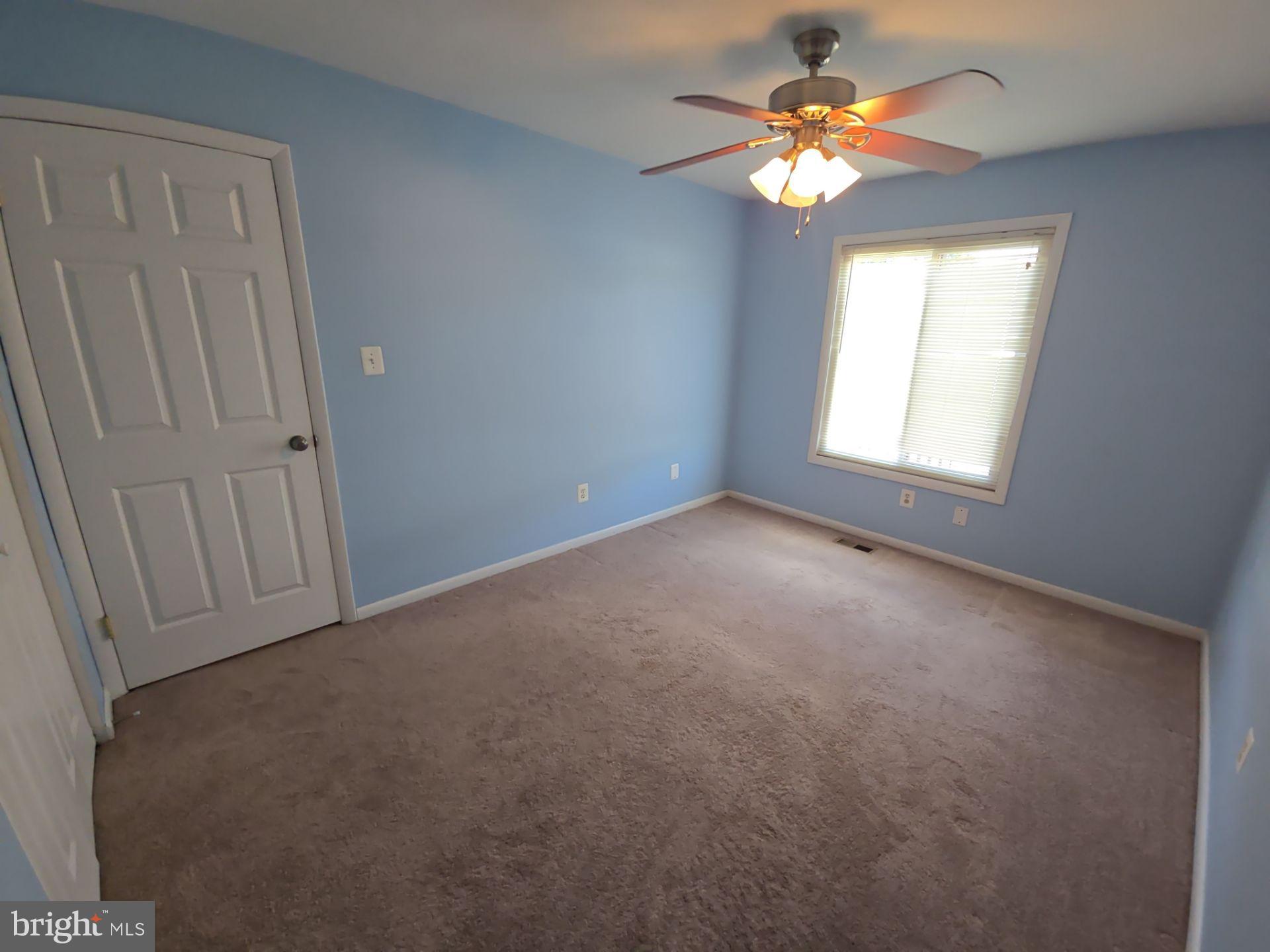 2115 Mager Drive Herndon, VA 20170 - Photo 16 of 41 an empty room with windows and fan