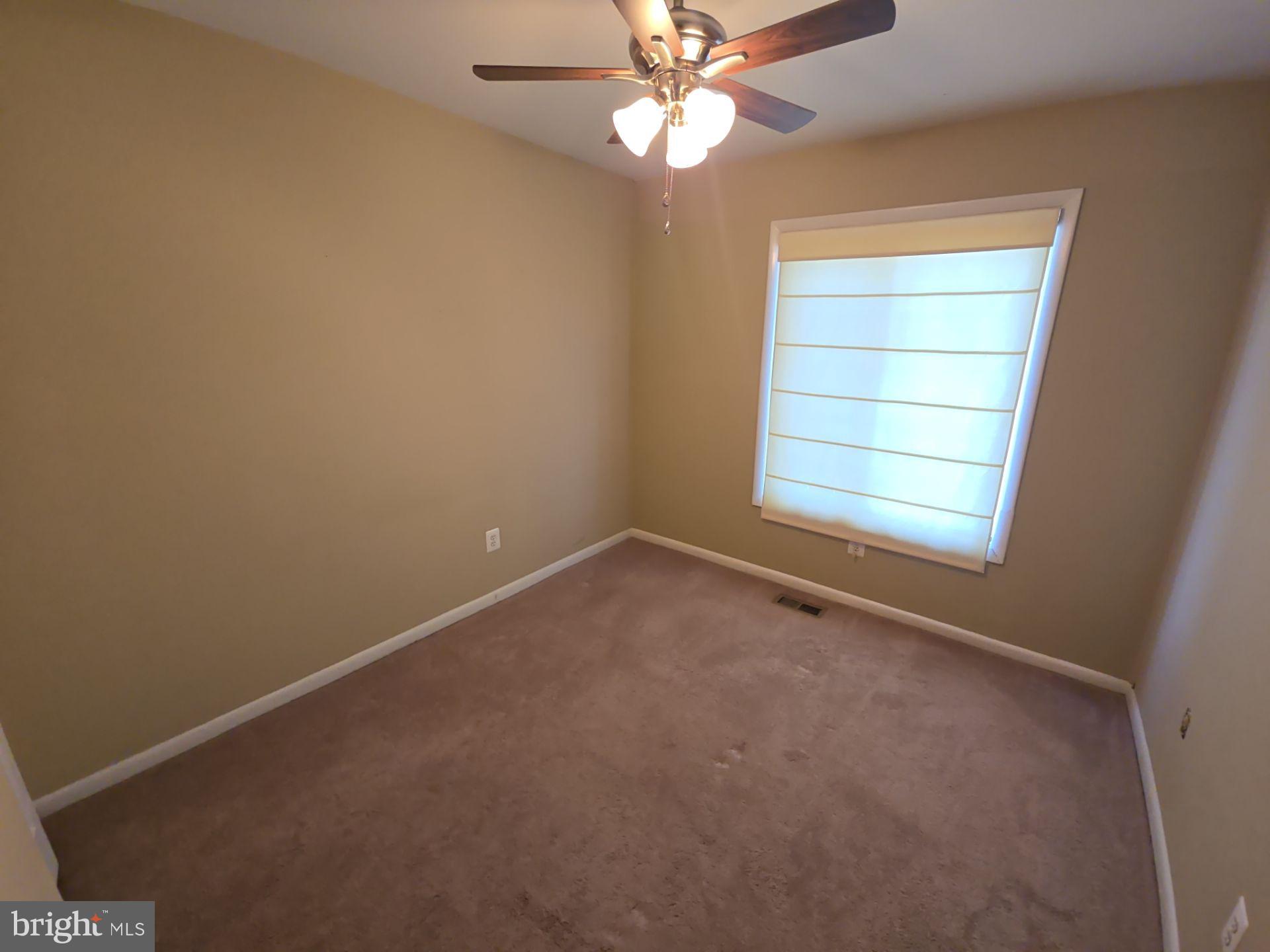 2115 Mager Drive Herndon, VA 20170 - Photo 18 of 41 an empty room with windows and fan