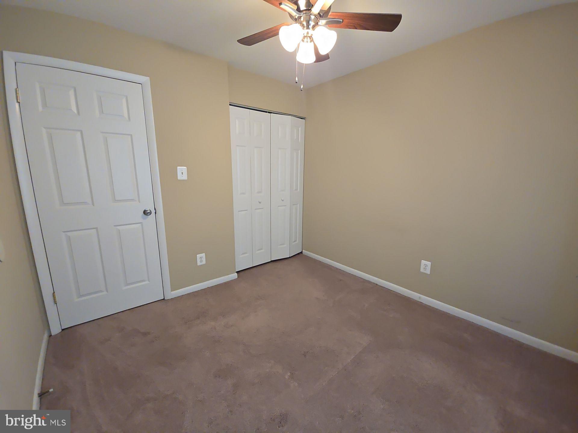 2115 Mager Drive Herndon, VA 20170 - Photo 19 of 41 an empty room with a chandelier fan
