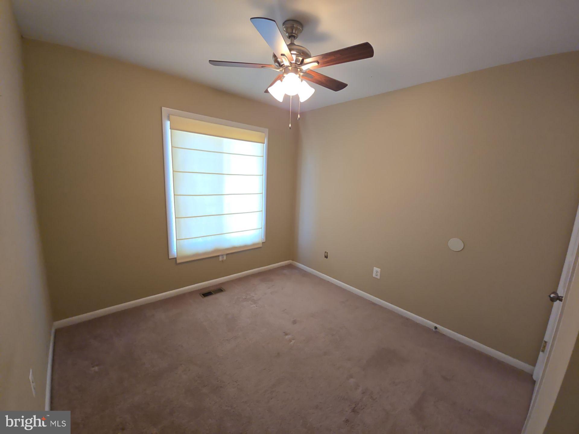 2115 Mager Drive Herndon, VA 20170 - Photo 22 of 41 an empty room with windows and chandelier fan