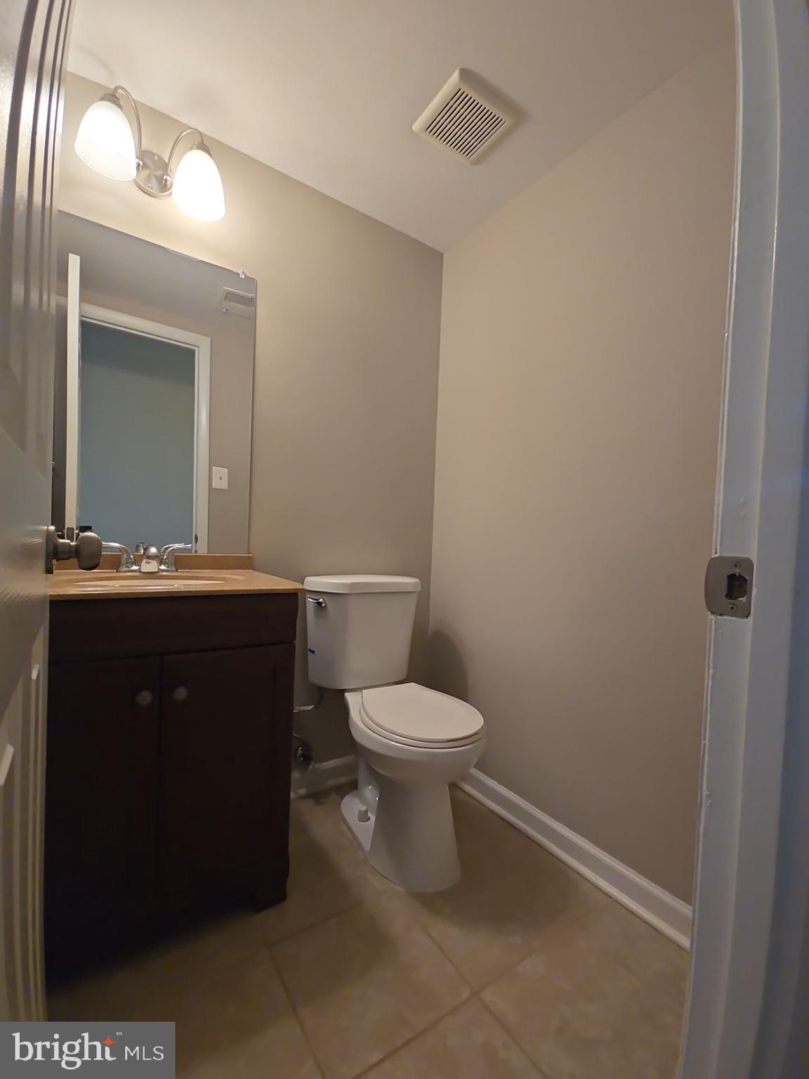 2115 Mager Drive Herndon, VA 20170 - Photo 28 of 41 a bathroom with a toilet sink and mirror