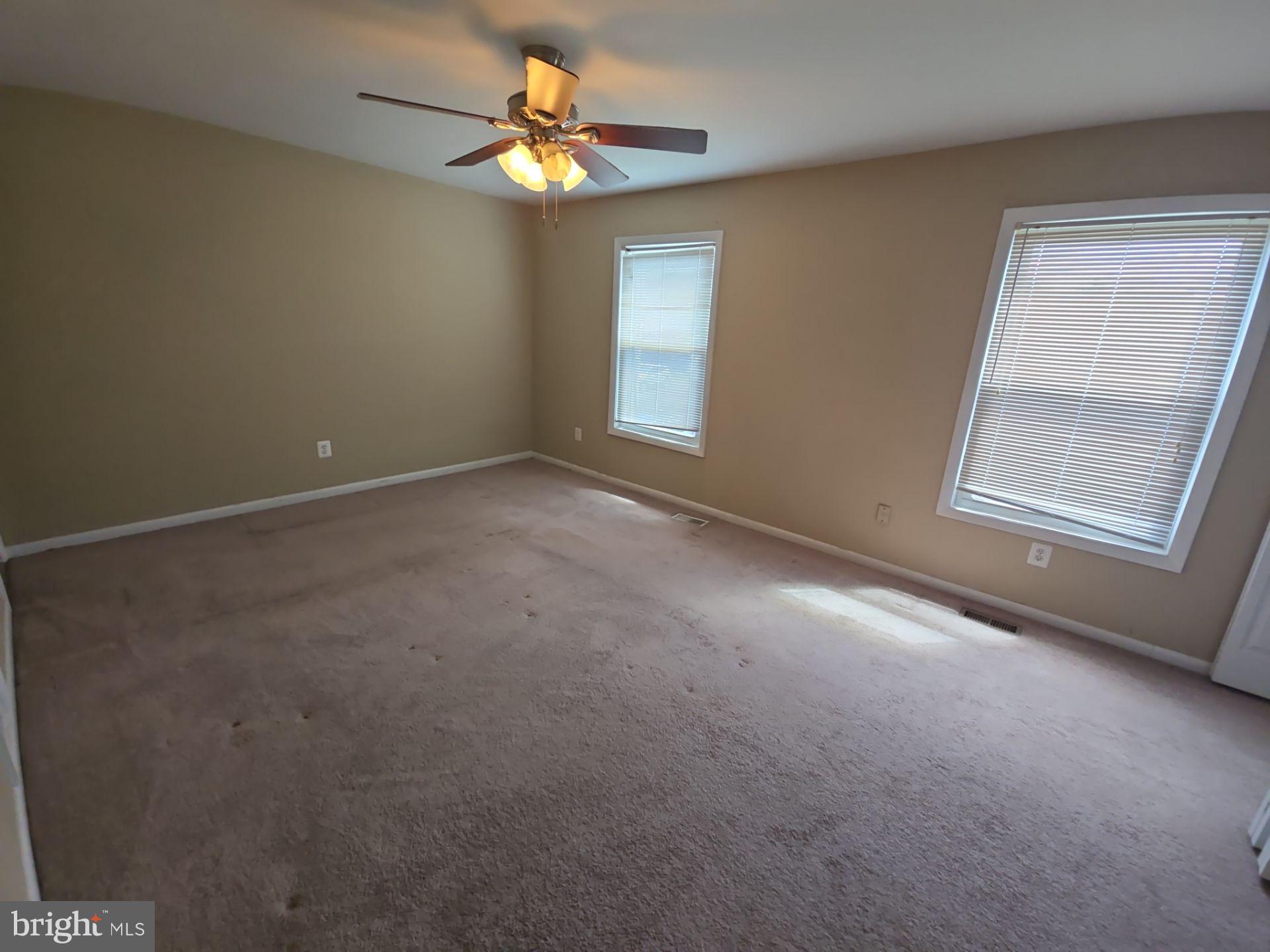 2115 Mager Drive Herndon, VA 20170 - Photo 31 of 41 an empty room with windows and fan