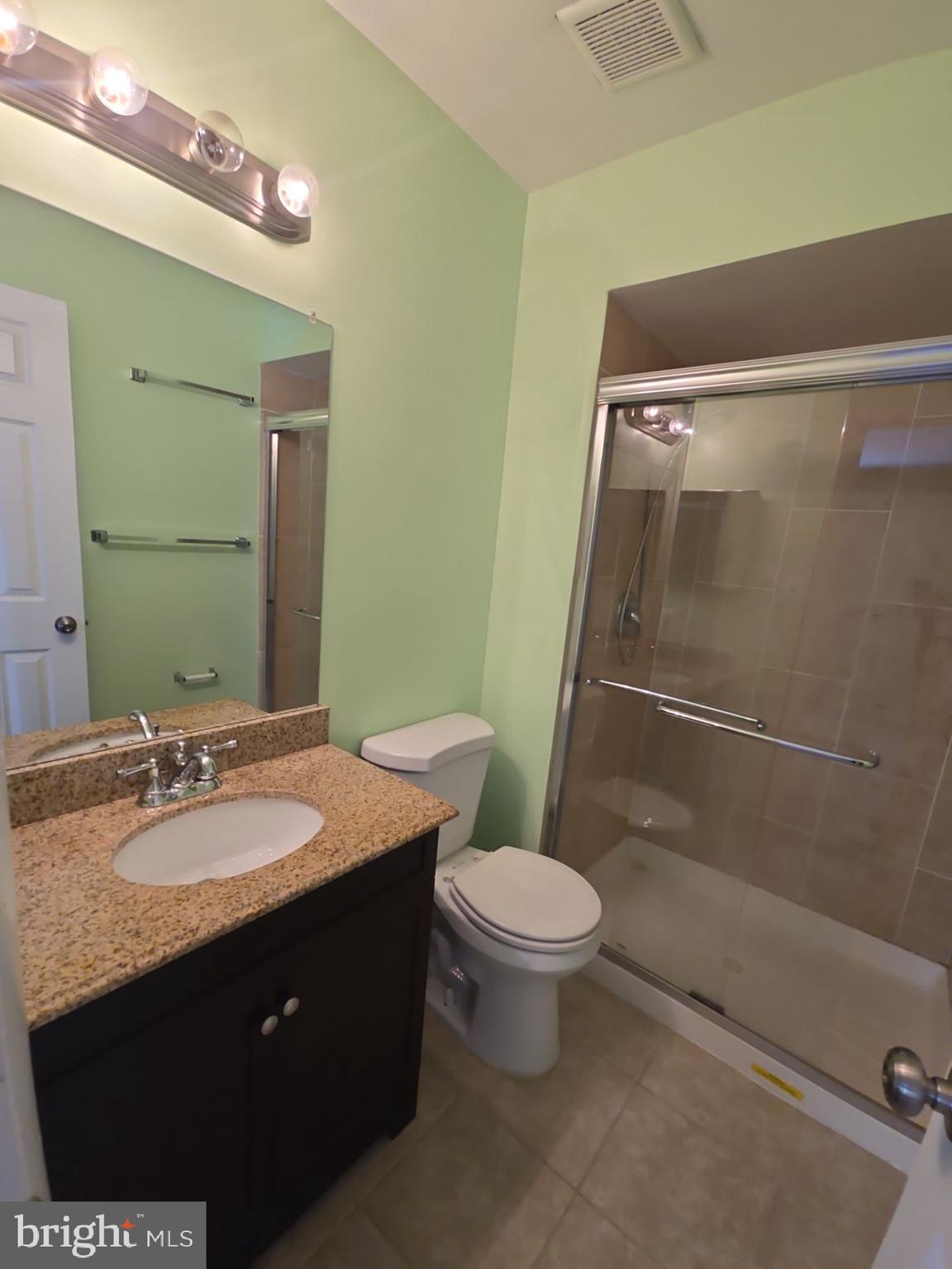 2115 Mager Drive Herndon, VA 20170 - Photo 33 of 41 a bathroom with a granite countertop sink toilet and shower