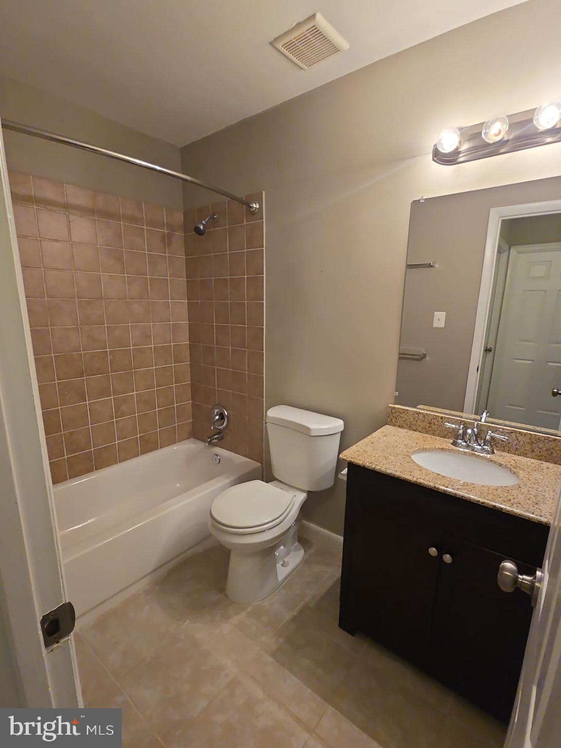 2115 Mager Drive Herndon, VA 20170 - Photo 36 of 41 a bathroom with a sink a toilet and shower