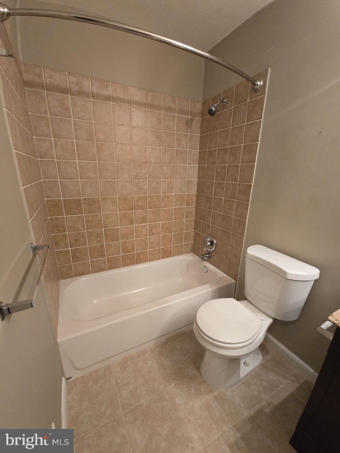2115 Mager Drive Herndon, VA 20170 - Photo 7 of 41 a white toilet sitting next to a bath tub and a shower