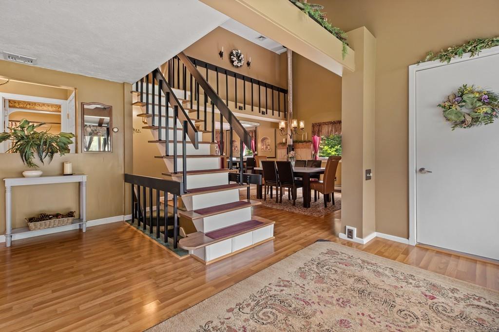 33 R F Higgins Drive Norwell, MA 02061 - Photo 11 of 34 a view of entryway livingroom and hall with wooden floor