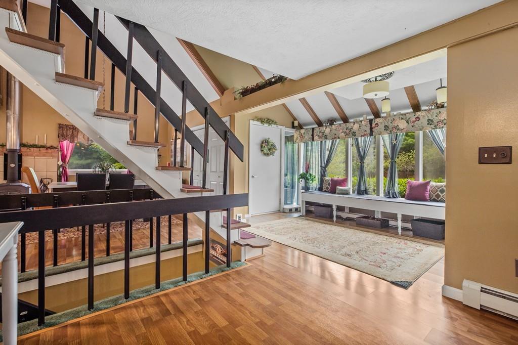 33 R F Higgins Drive Norwell, MA 02061 - Photo 12 of 34 a view of an outdoor dining space with wooden floor and stairs