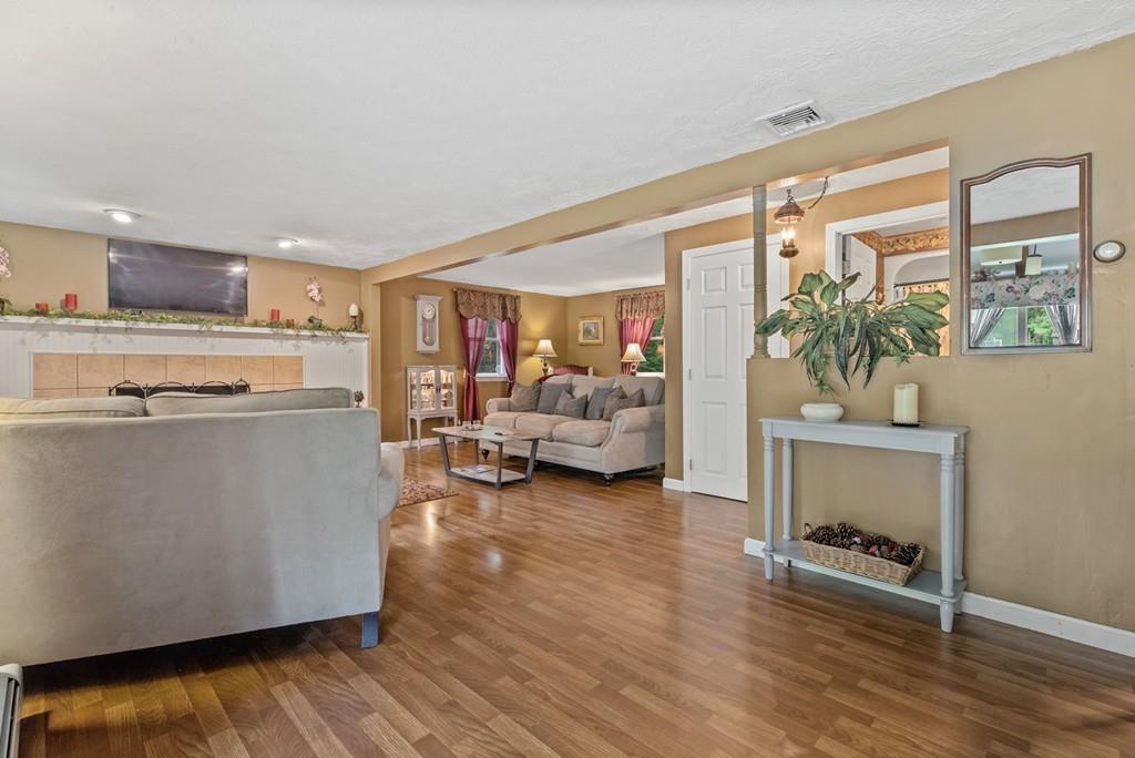 33 R F Higgins Drive Norwell, MA 02061 - Photo 13 of 34 a living room with furniture and a table