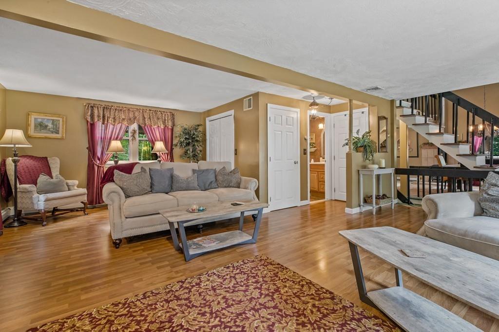 33 R F Higgins Drive Norwell, MA 02061 - Photo 14 of 34 a living room with furniture and a rug
