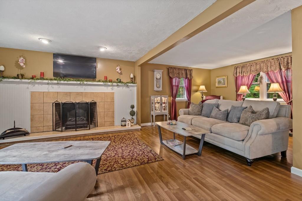 33 R F Higgins Drive Norwell, MA 02061 - Photo 15 of 34 a living room with furniture and a fireplace