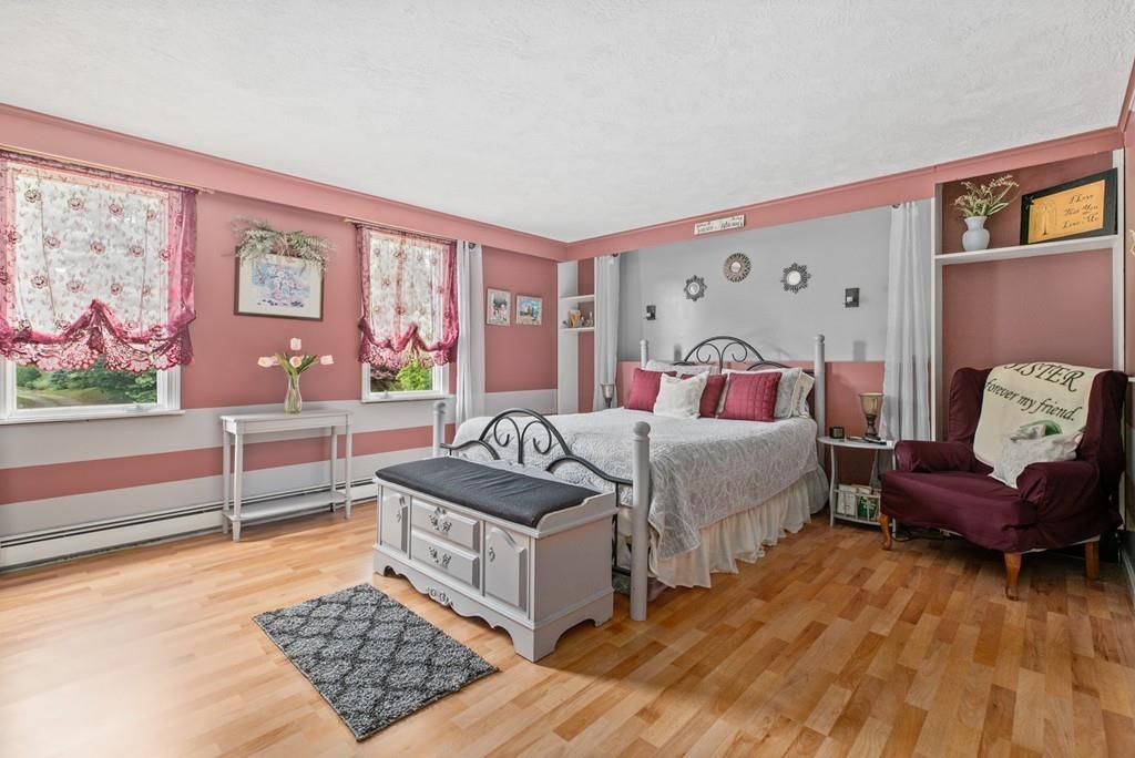 33 R F Higgins Drive Norwell, MA 02061 - Photo 17 of 34 a bedroom with furniture and a couch