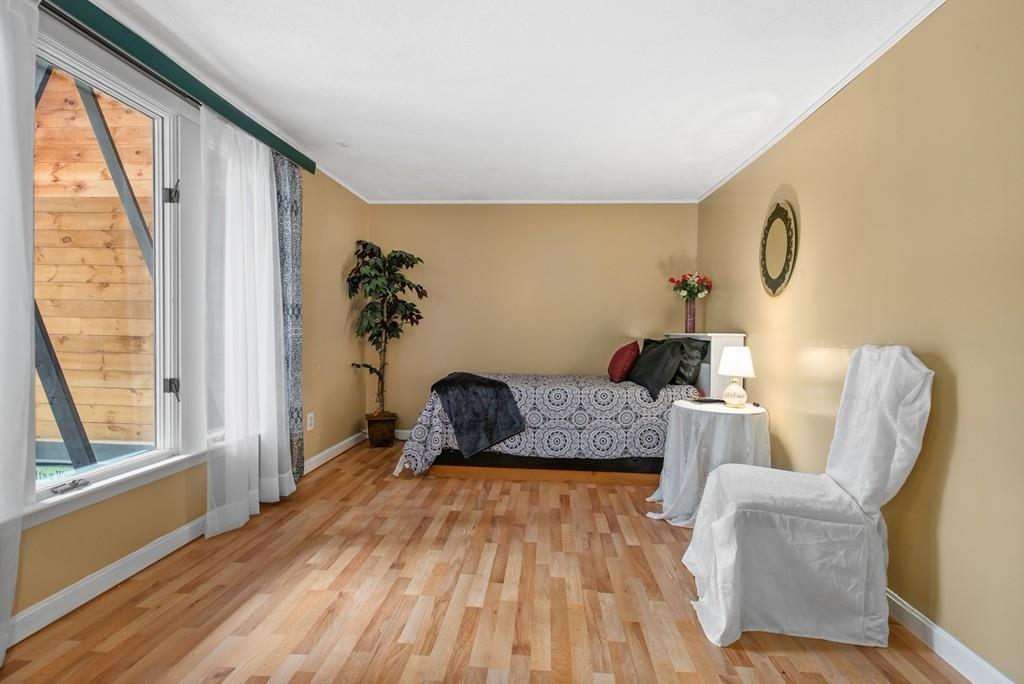 33 R F Higgins Drive Norwell, MA 02061 - Photo 20 of 34 a living room with furniture and a large window