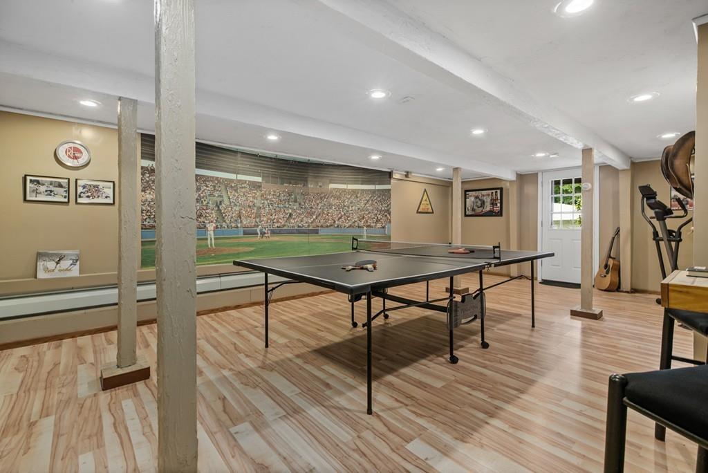 33 R F Higgins Drive Norwell, MA 02061 - Photo 23 of 34 a room with lots of furniture and wooden floors