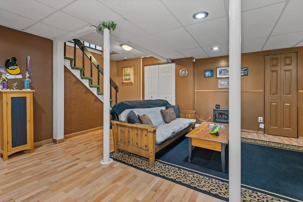 33 R F Higgins Drive Norwell, MA 02061 - Photo 25 of 34 a living room with furniture and a wooden floor