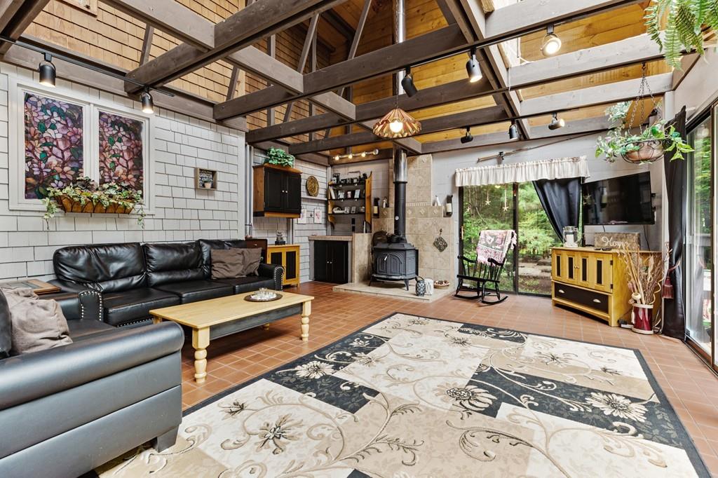 33 R F Higgins Drive Norwell, MA 02061 - Photo 3 of 34 a outdoor living space with furniture and a flat screen tv